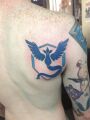 Team Mystic tattoo, perfectly placed next to his ((((((Bernie Sanders)))))) tattoo and his "Seattle Seahawks Back2Back World Champs!" tattoo.