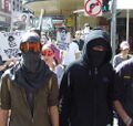 Marching through the CBD to the Game Zone.