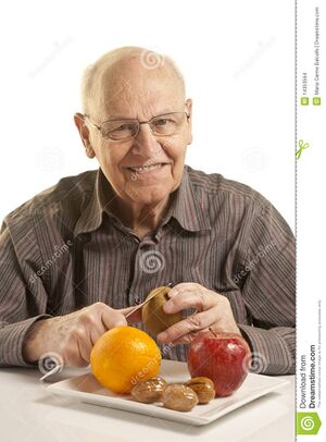 Senior-man-eating-fresh-fruit-14353564.jpg