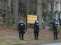 Police by the sign for the Scientology Center in Dunwoody.