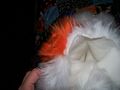 Glued the orange fur on top of the white fur.