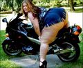 this hog attempts to attract potential male companions using her motorcycle. Almost always, these methods do not work.