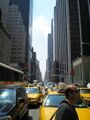 A typical Manhattan street. Also included: Retarded fugly guy who blocks traffic and at least 100 taxis.