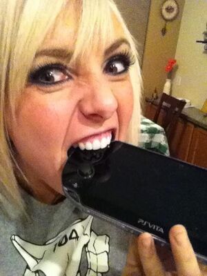 Jessica Nigri bites PSVITA.jpg