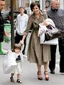 Yup. That's exactly what a six month old looks like. Fully dressed, full head of hair, walking and carrying a shopping bag. Nothing suspicious there.