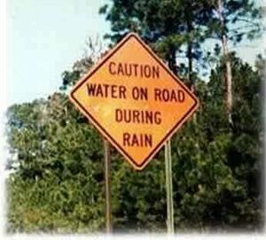 Caution-water-on-road-during-rain.jpg