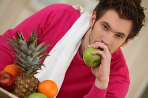 Photodune-2232647-pensive-young-man-eating-fruit-s.jpg