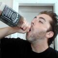 a virtue signalling hayven pretending to chug jack daniels, which is actually just coca cola in a jack daniels bottle.