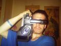 Rootbrian with the 20 year old video camera he uses to film CP in his mom's apartment.