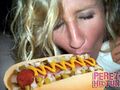 Ke$ha enjoys a wiener.