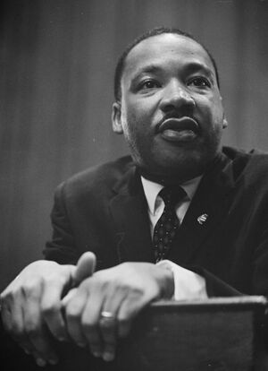 -Martin-Luther-King-1964-leaning-on-a-lectern.jpg