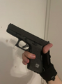 Arthur's glock (Notice his fag looking tactical gloves)