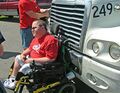 Cripples often hitch rides on the front of large trucks for quick transportation.