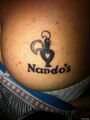 It doesn't get any cheekier than a tattoo of the Nando's logo permanently scarred into your buttock. Top bantz, m8.