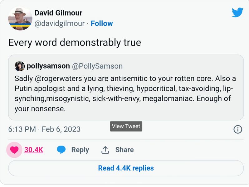 File:David Gilmour hides behind his wife.jpg